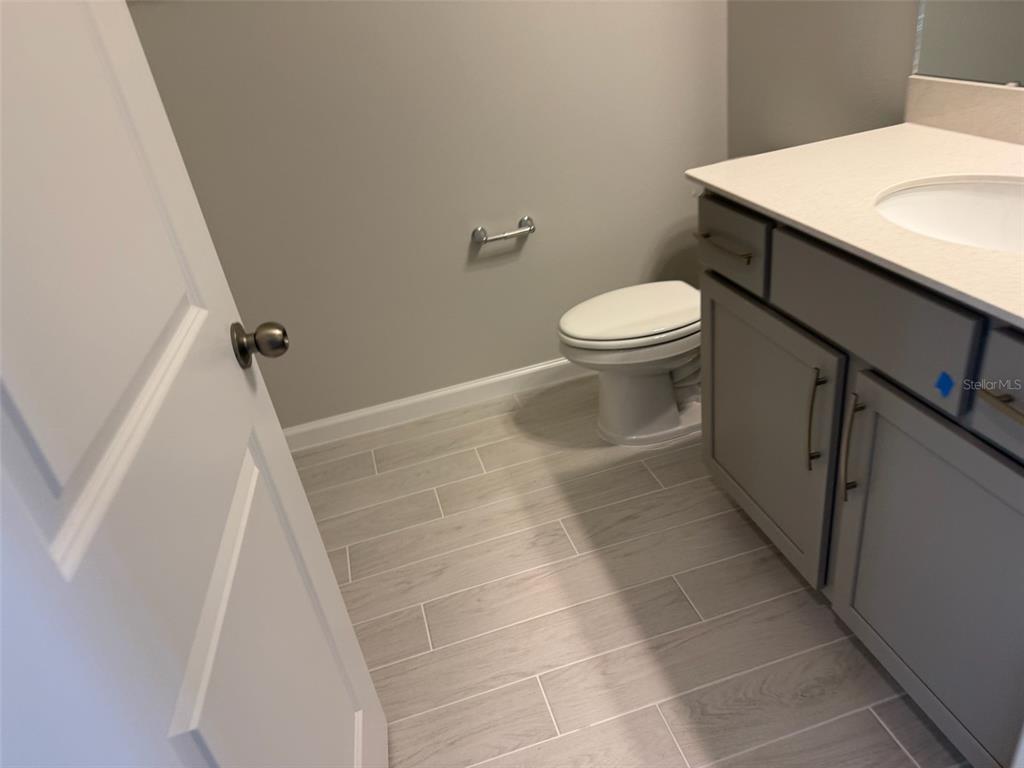 619 Pothos Street Apopka, FL 32703 - Photo 31 of 37 a bathroom with a sink and toilet