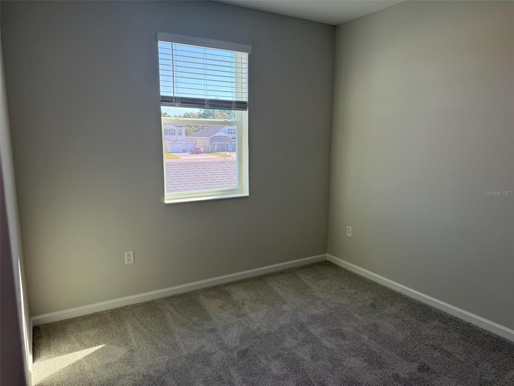619 Pothos Street Apopka, FL 32703 - Photo 34 of 37 an empty room with a window