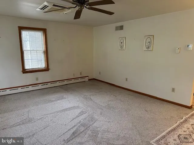 a view of a hallway with a large window
