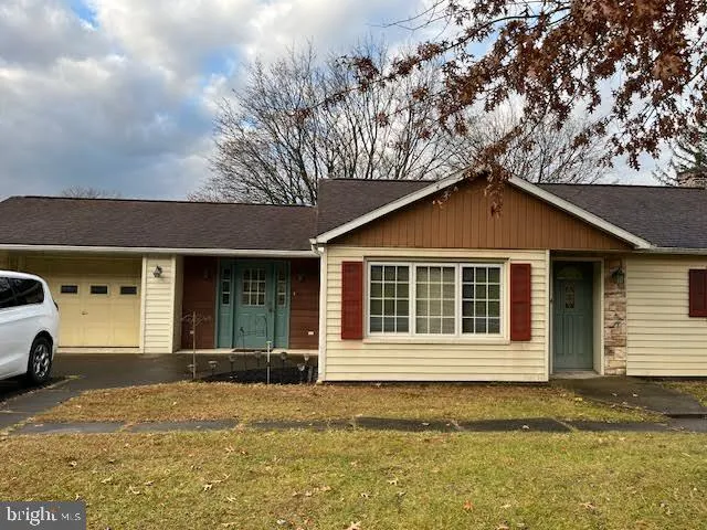 a view of a brick house with a large window