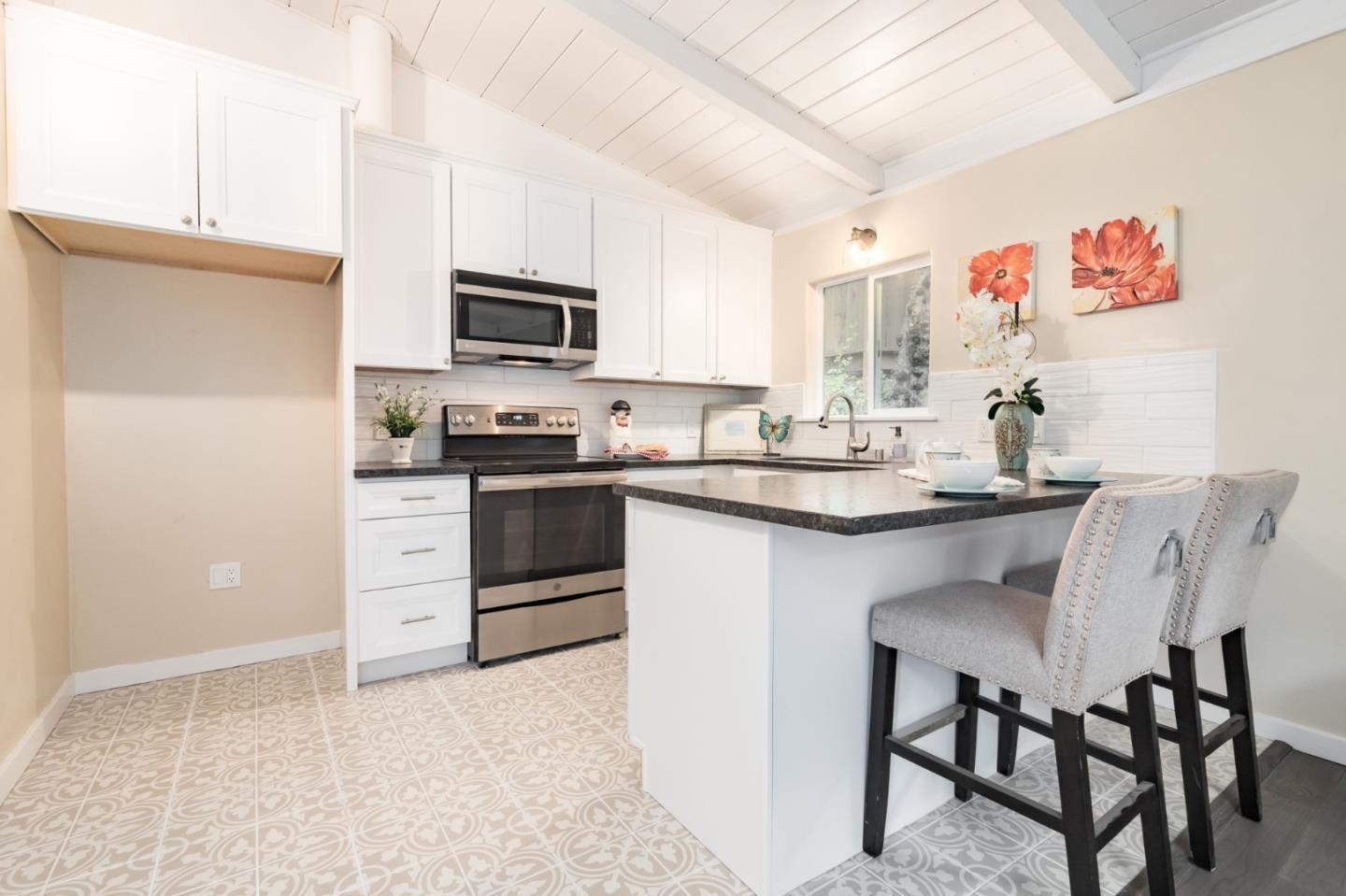 665 Cathedral Drive Aptos, CA 95003 - Photo 12 of 23 a kitchen with a sink cabinets and stainless steel appliances