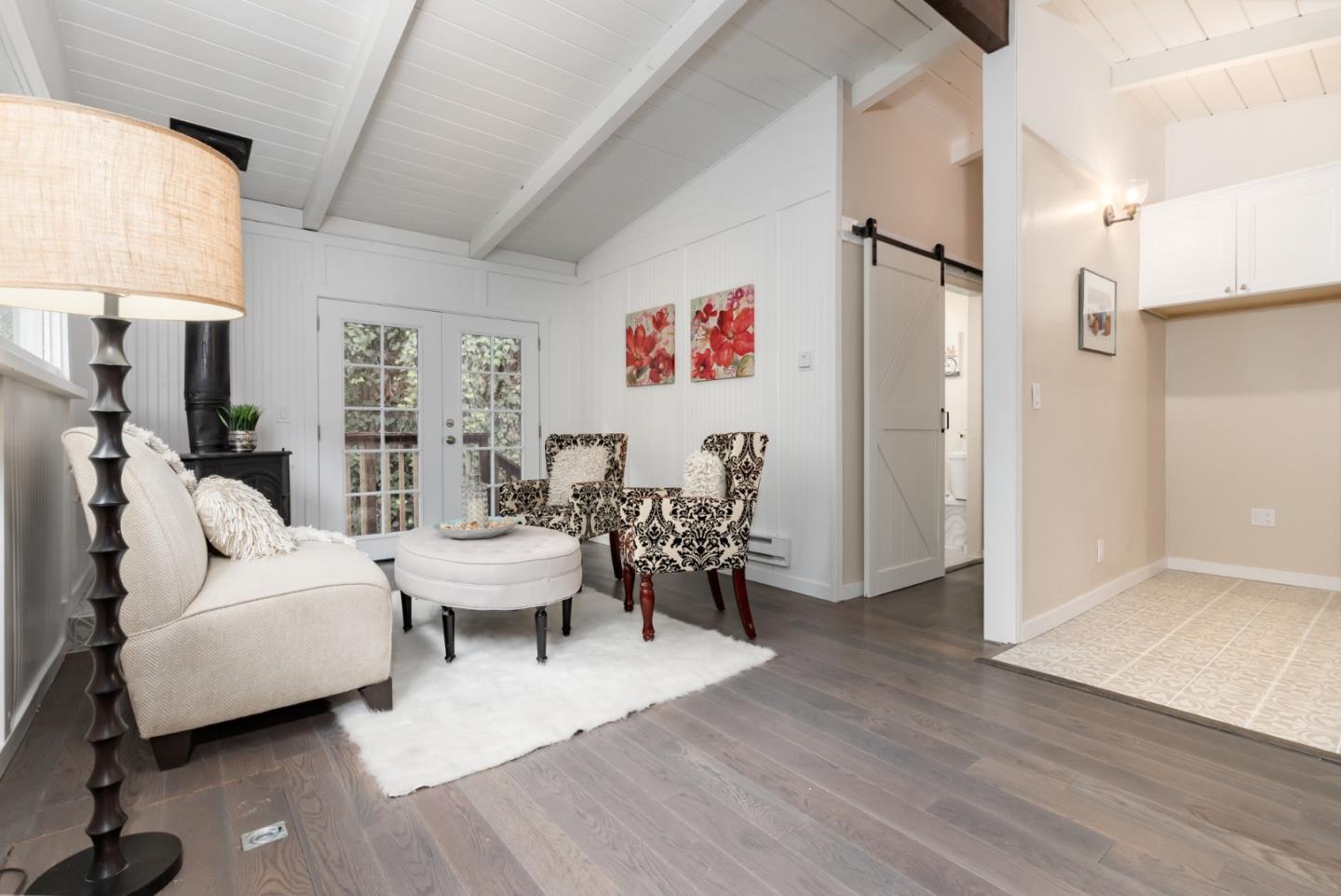 665 Cathedral Drive Aptos, CA 95003 - Photo 14 of 23 a living room with furniture and a large window