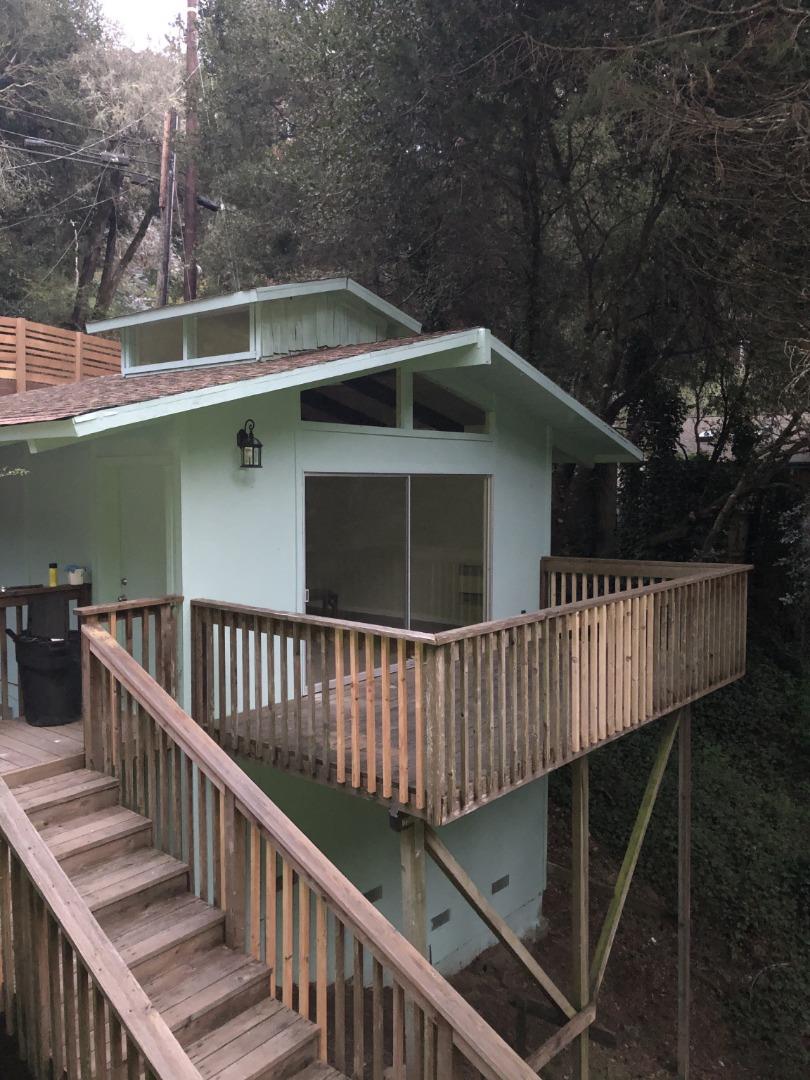 665 Cathedral Drive Aptos, CA 95003 - Photo 19 of 23 a roof deck with wooden floor and fence