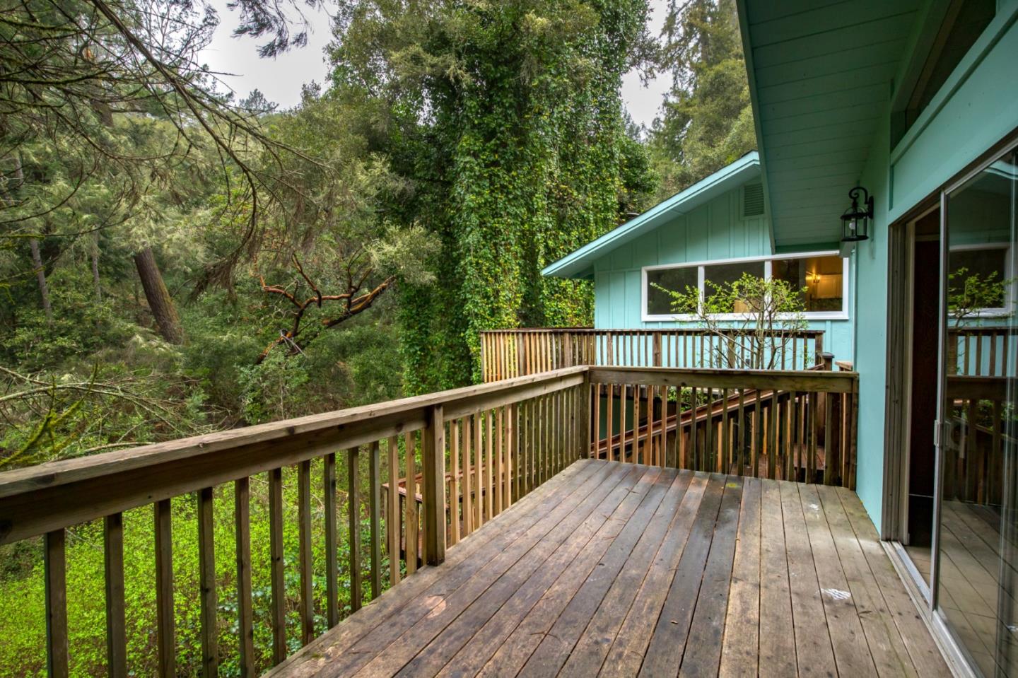 665 Cathedral Drive Aptos, CA 95003 - Photo 20 of 23 a view of a wooden deck with large trees