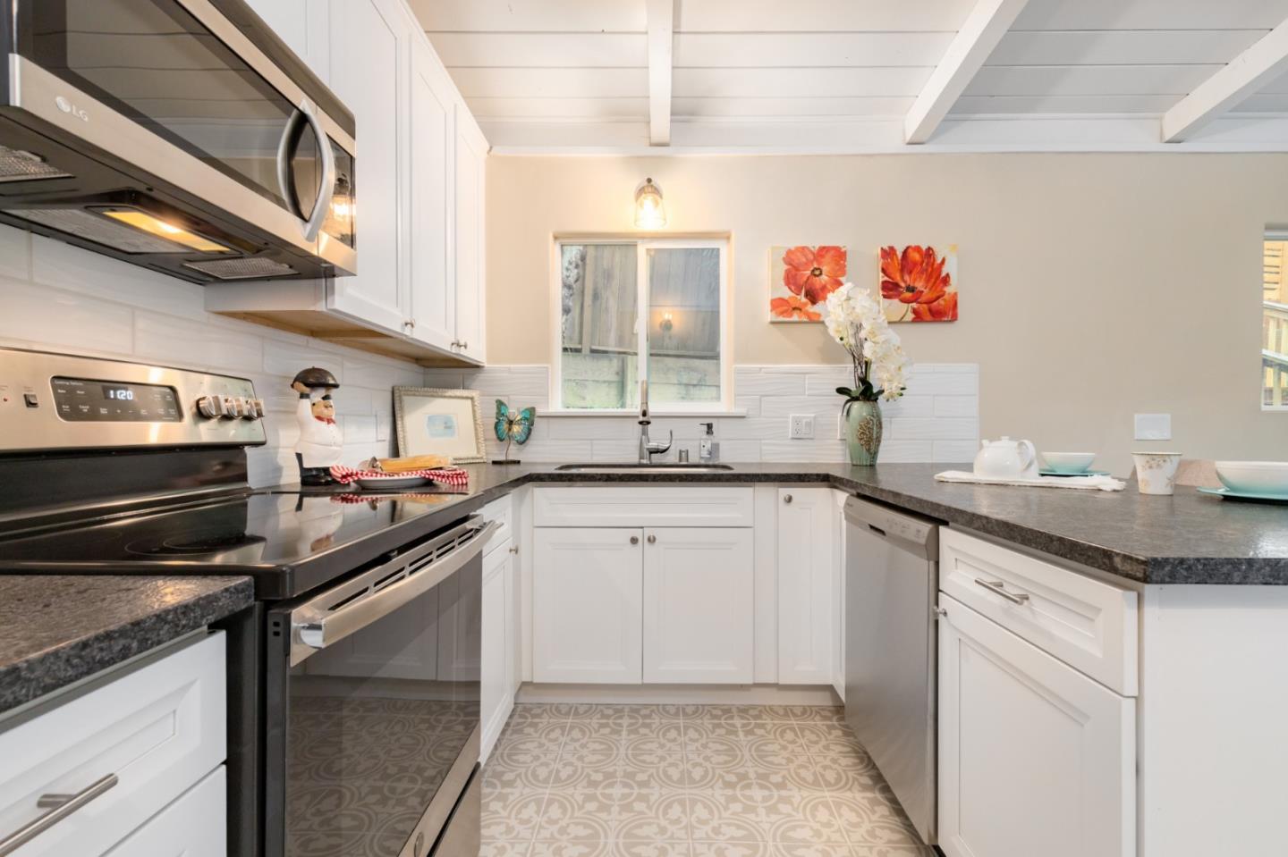 665 Cathedral Drive Aptos, CA 95003 - Photo 2 of 23 a kitchen with a sink stove and microwave