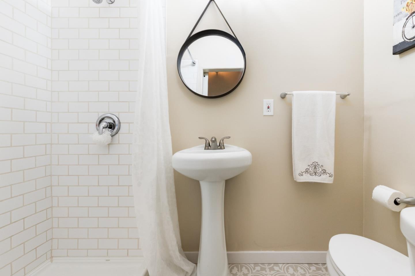 665 Cathedral Drive Aptos, CA 95003 - Photo 5 of 23 a bathroom with a sink a mirror and a toilet