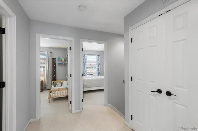 a view of a patio with couches chairs and wooden floor