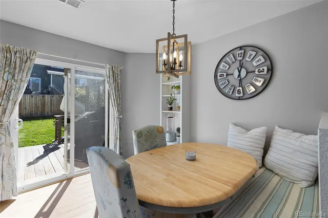 a kitchen with stainless steel appliances granite countertop a refrigerator a stove and a sink