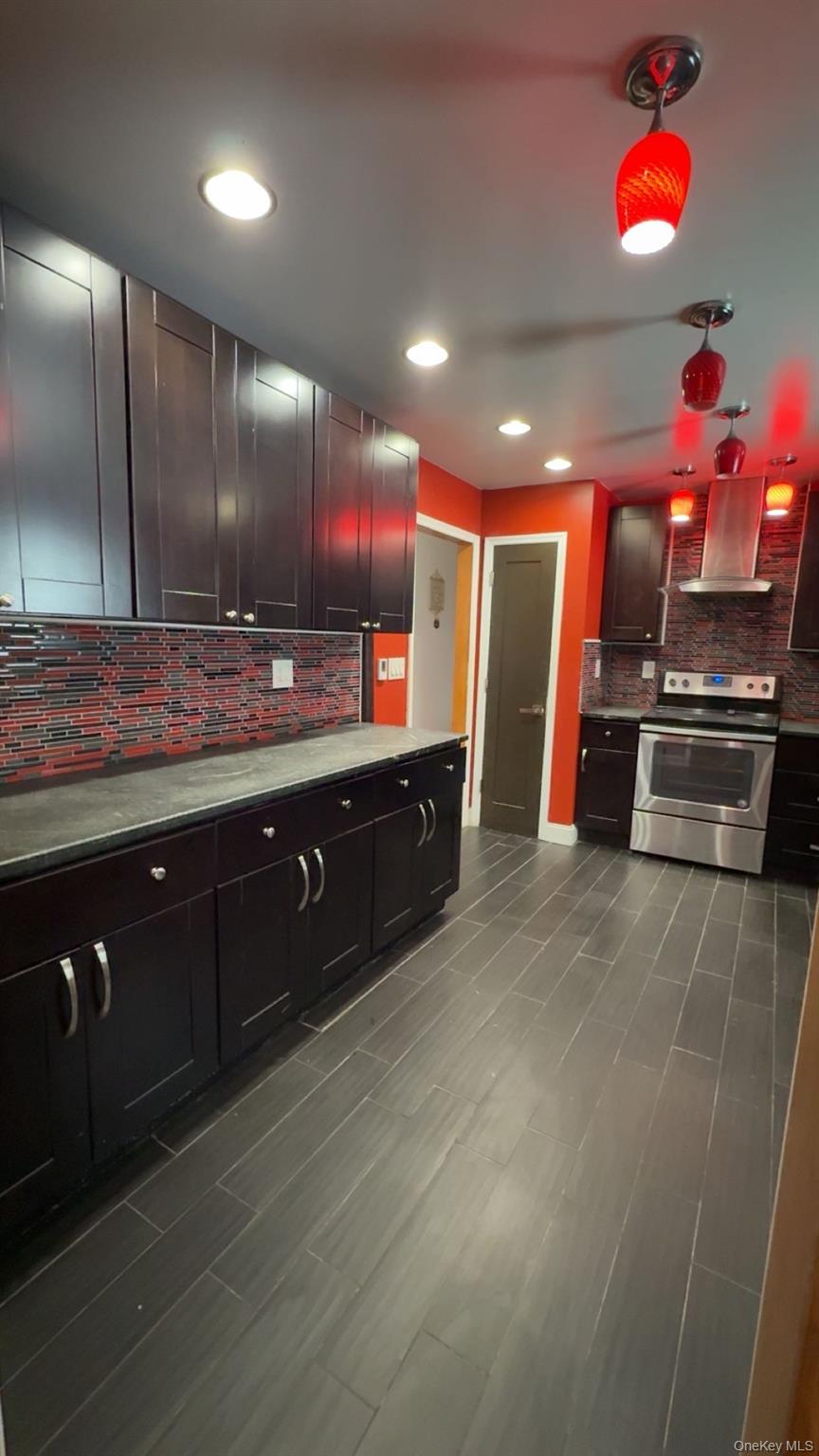 93 Old Mill Road Wallkill, NY 12589 - Photo 15 of 39 Kitchen featuring electric stove, island range hood, backsplash, and recessed lighting