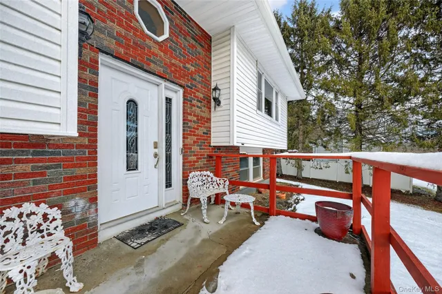 a view of a livingroom with furniture and a chandelier fan