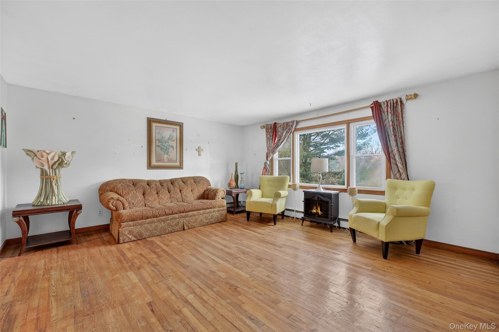 93 Old Mill Road Wallkill, NY 12589 - Photo 9 of 39 Living room with a wood stove and light wood finished floors