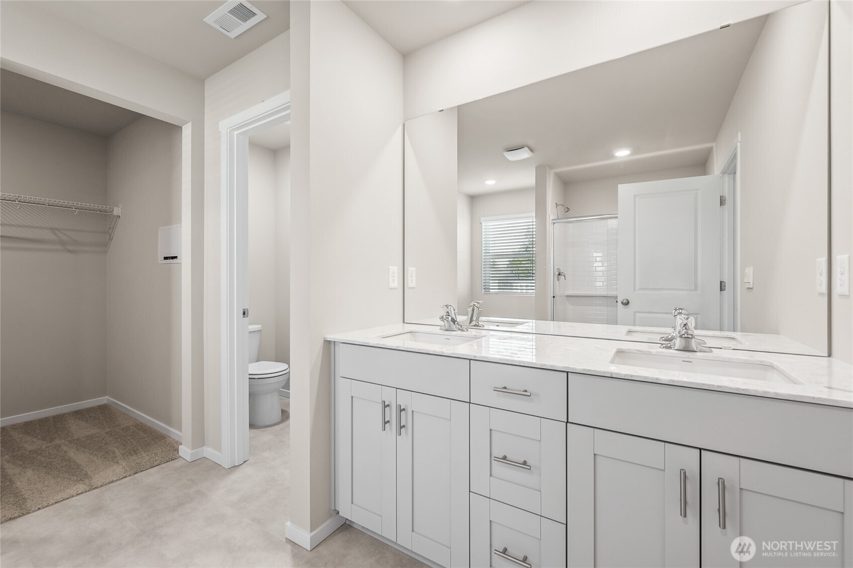 5801 Ivanoff Lane Southwest, Unit 68 Port Orchard, WA 98367 - Photo 14 of 25 a bathroom with a granite countertop sink mirror and double