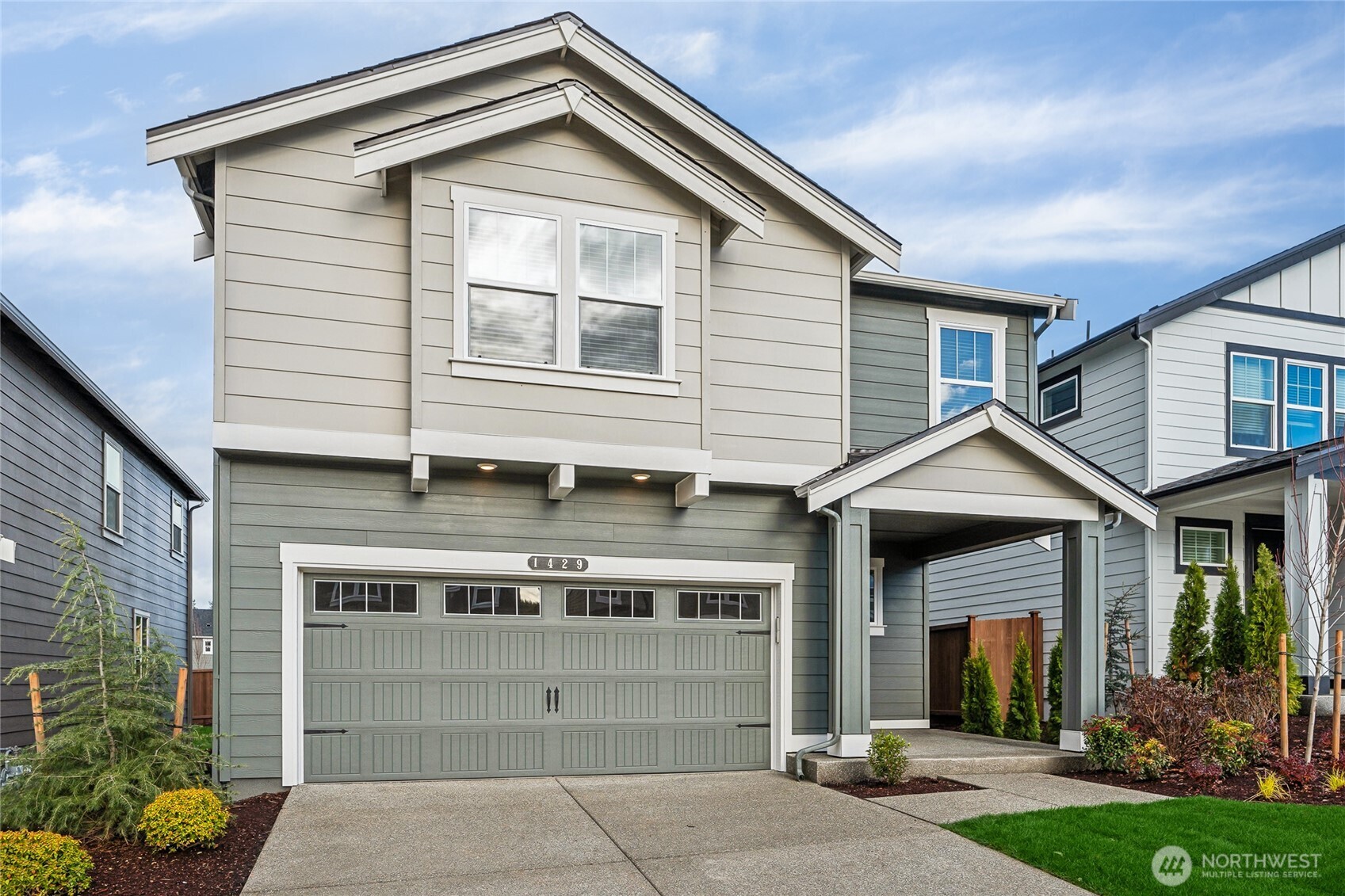 5801 Ivanoff Lane Southwest, Unit 68 Port Orchard, WA 98367 - Photo 25 of 25 a view of a house with a yard and potted plants