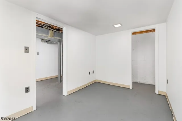 a view of a white building with many windows