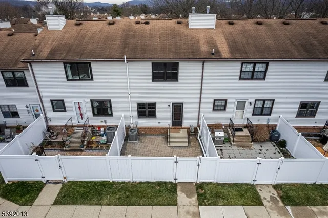 a view of a house with a door and wooden floor