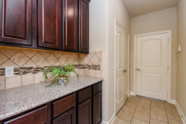 a kitchen with sink and cabinets