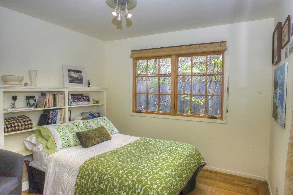 1452 Adobe Drive Pacifica, CA 94044 - Photo 13 of 23 a bedroom with a bed dresser and a window