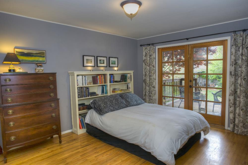 1452 Adobe Drive Pacifica, CA 94044 - Photo 15 of 23 a bedroom with a large bed and a window