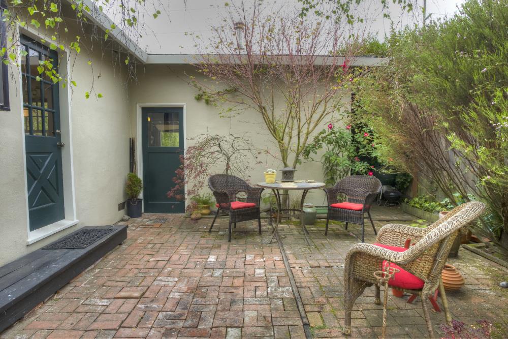 1452 Adobe Drive Pacifica, CA 94044 - Photo 17 of 23 a view of a chairs and table in backyard of a house
