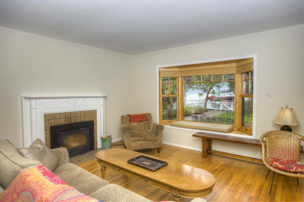 1452 Adobe Drive Pacifica, CA 94044 - Photo 5 of 23 a living room with furniture and a fireplace