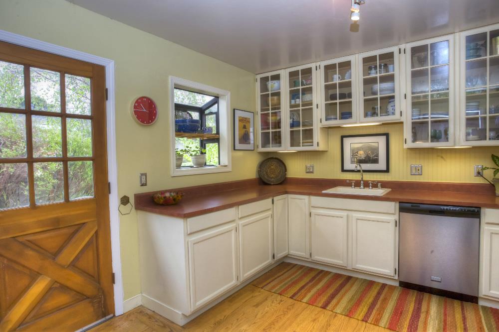 1452 Adobe Drive Pacifica, CA 94044 - Photo 10 of 23 a kitchen with a sink and cabinets