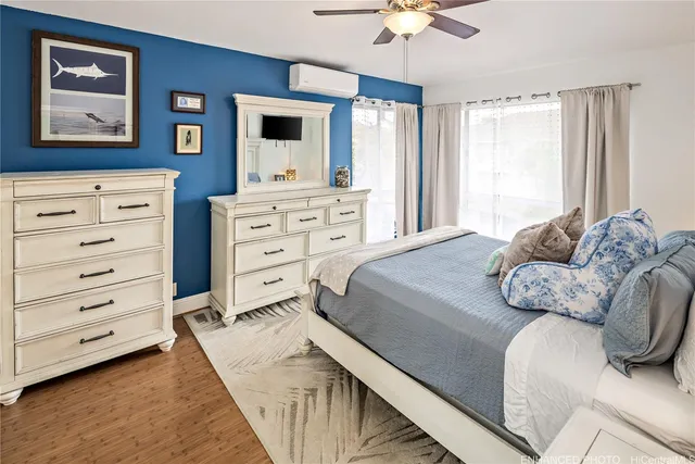 a bedroom with a bed and ceiling fan