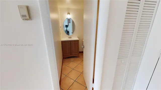 a en suite bathroom with a sink and mirror
