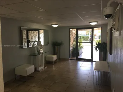 a kitchen with lots of counter top space and a wooden floor