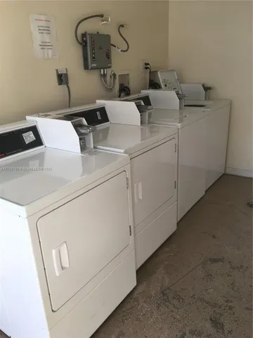 a view of a tall building next to a road