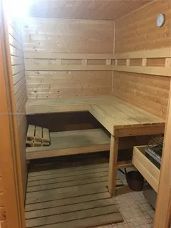 a living room with furniture a window and a fireplace