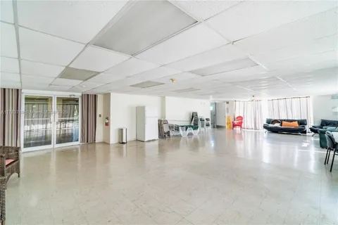 a view of a building with a yard