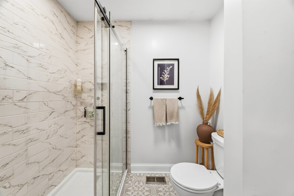 752 North Brookdale Drive Schaumburg, IL 60169 - Photo 14 of 23 a bathroom with a toilet and a shower