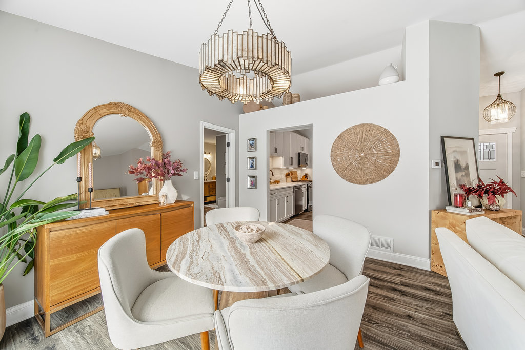 752 North Brookdale Drive Schaumburg, IL 60169 - Photo 8 of 23 a living room with dining table a couch and a chandelier