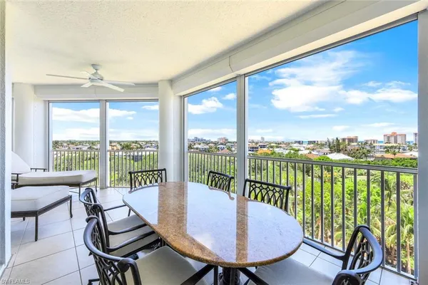 a view of a city from a dining room with furniture window and outside view