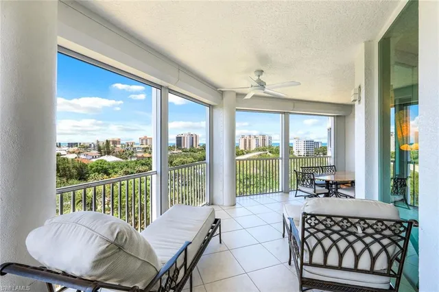 a living room with a large window and table