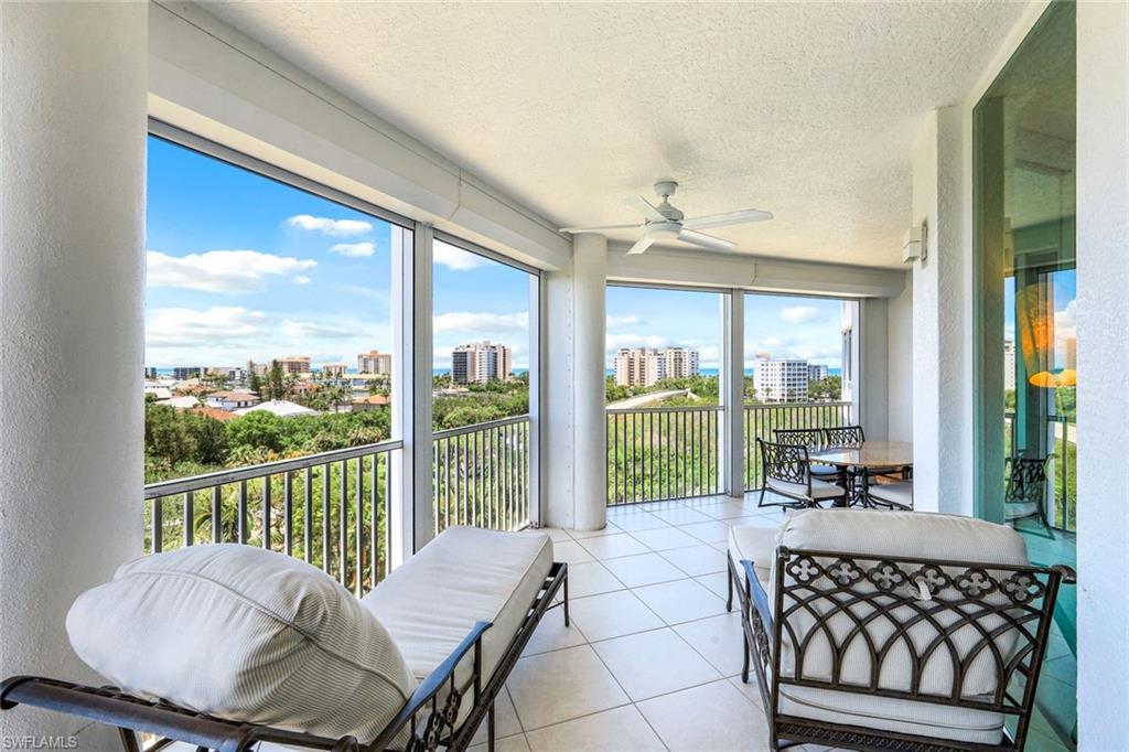 300 Dunes Boulevard, Unit 602 Naples, FL 34110 - Photo 18 of 18 a living room with a large window and table