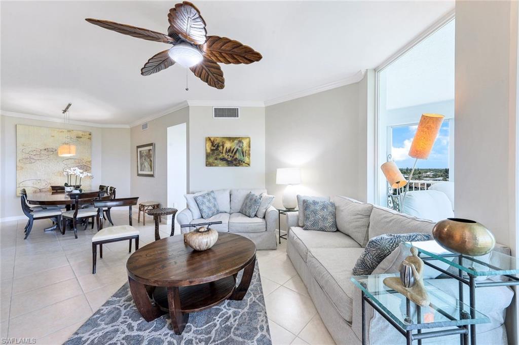 300 Dunes Boulevard, Unit 602 Naples, FL 34110 - Photo 3 of 18 a living room with furniture and a large window