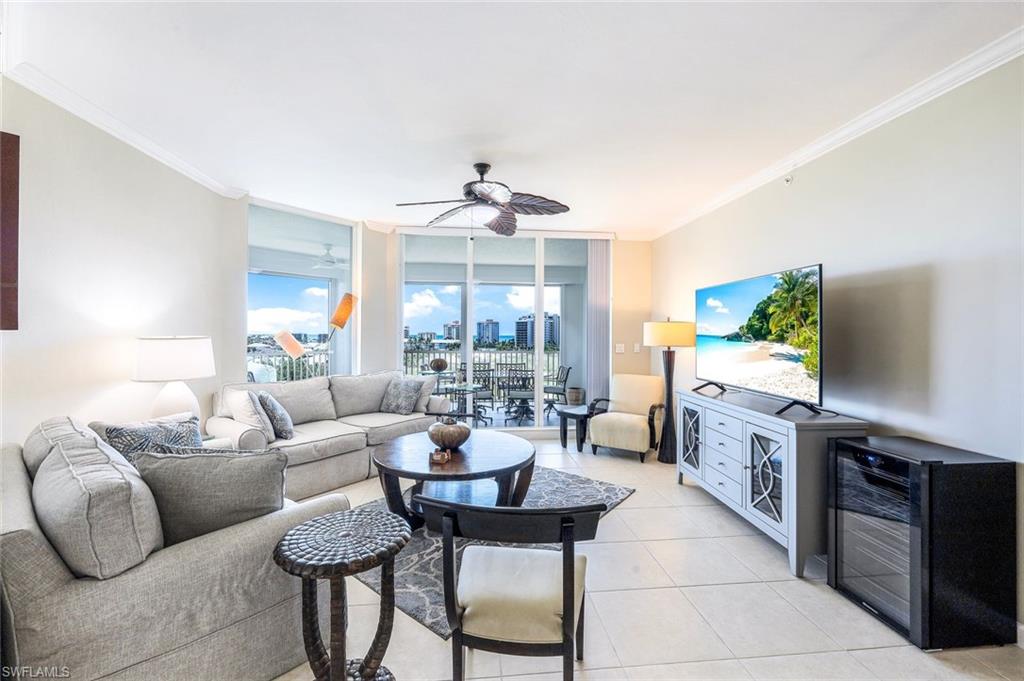 300 Dunes Boulevard, Unit 602 Naples, FL 34110 - Photo 5 of 18 a living room with furniture and a kitchen