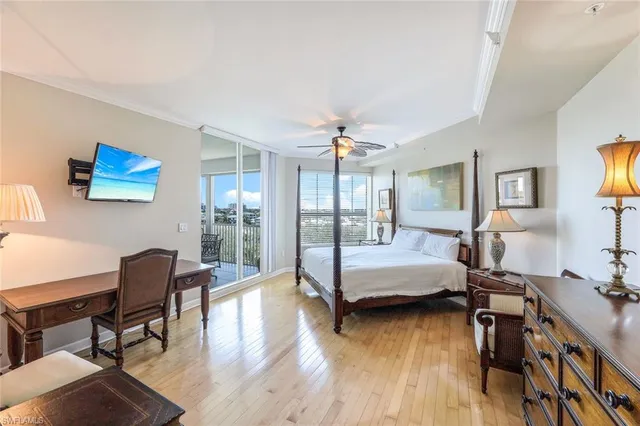 a bedroom with furniture and a wooden floor