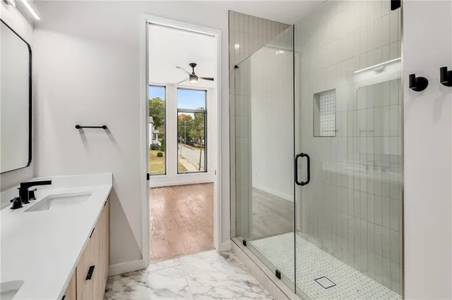 a bathroom with a shower and a sink