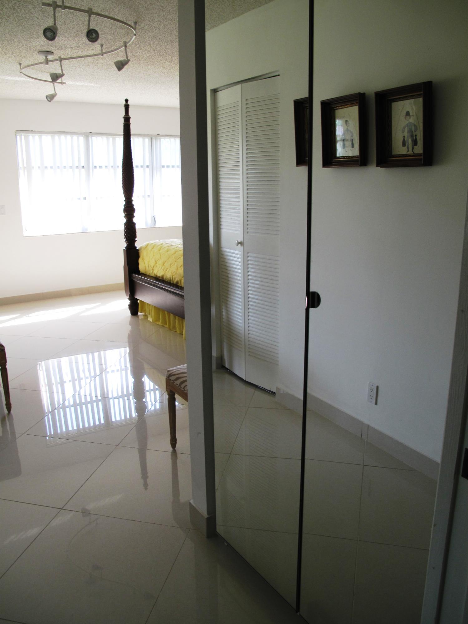 14215 Nesting Way, Unit C Delray Beach, FL 33484 - Photo 31 of 50 linen closet in master bedroom