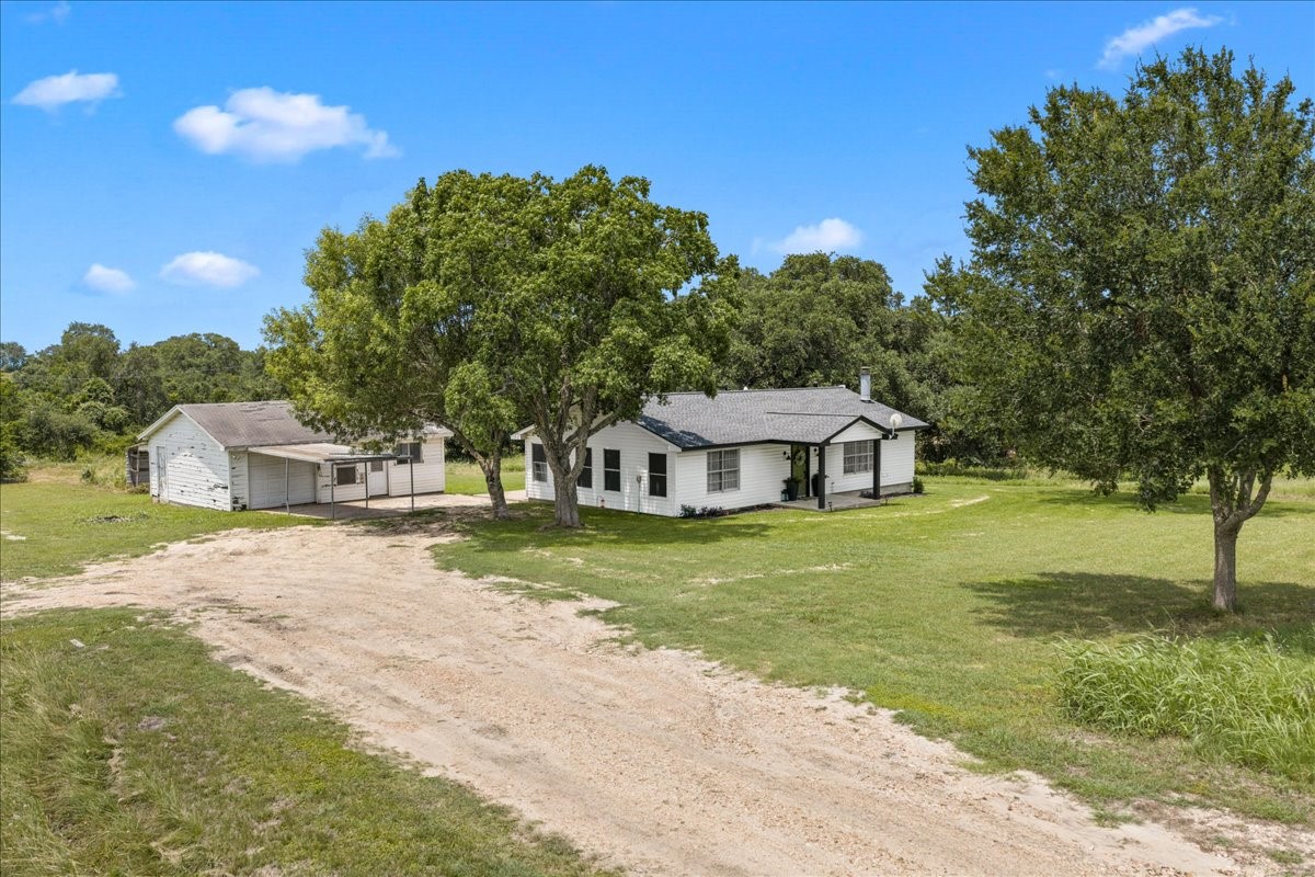 4228 Fm 390 Road West Burton, TX 77835 - Photo 6 of 25 And features a detached garage and a few sheds