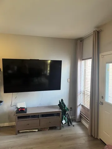 a living room with a couch and a flat screen tv