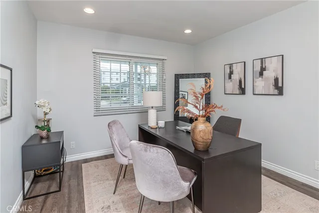 a work room with furniture and a window