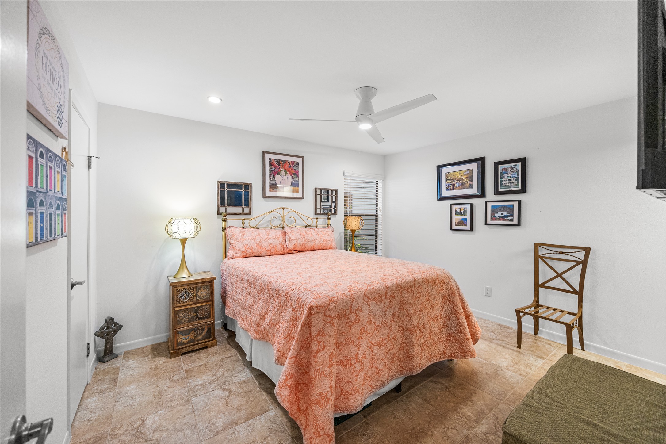 12900 Walden Road, Unit 1009J Montgomery, TX 77356 - Photo 15 of 24 a bedroom with a large bed and a chandelier