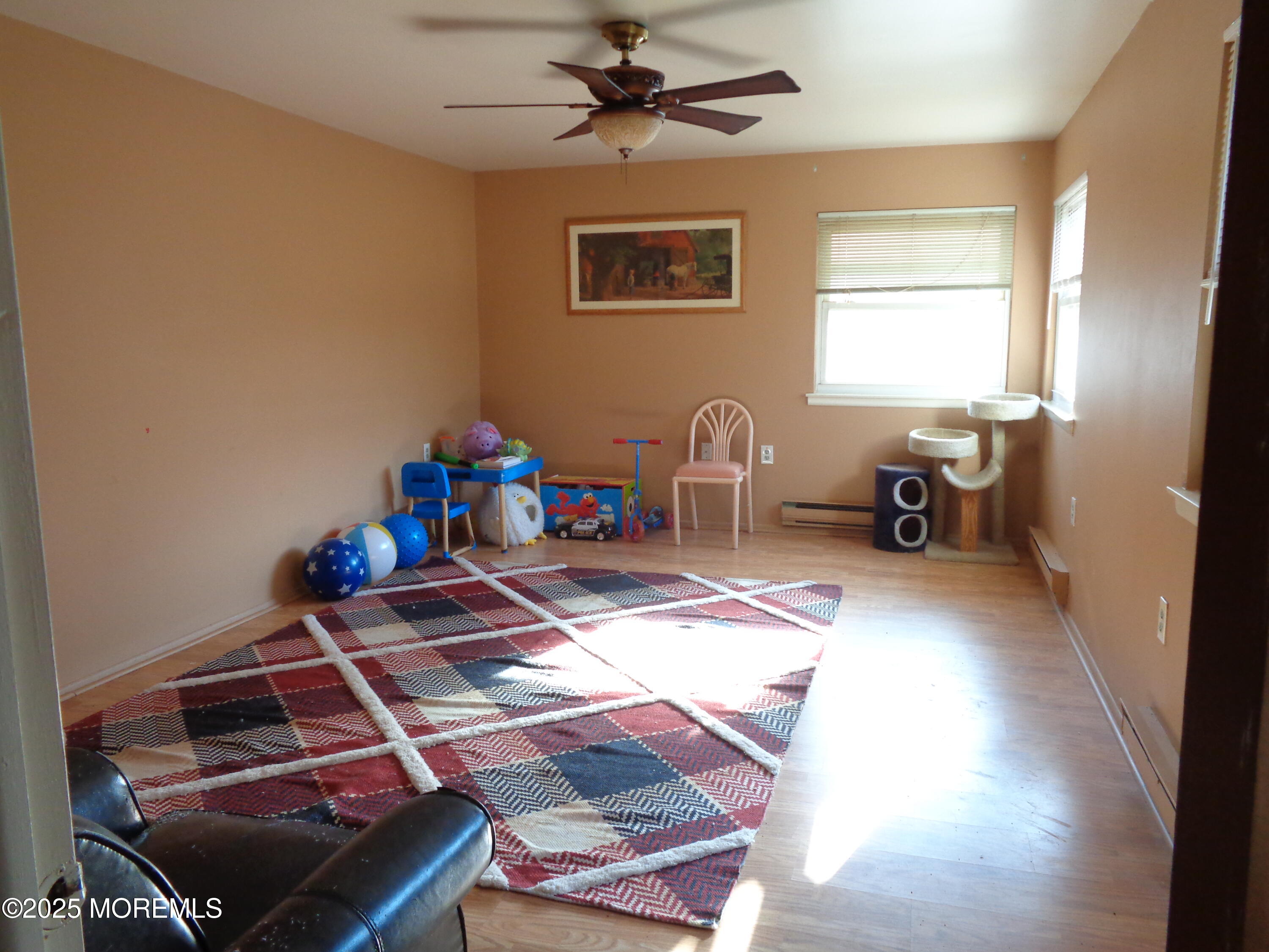 22 A Homestead Drive Whiting, NJ 08759 - Photo 11 of 15 a bedroom with a bed and a chandelier