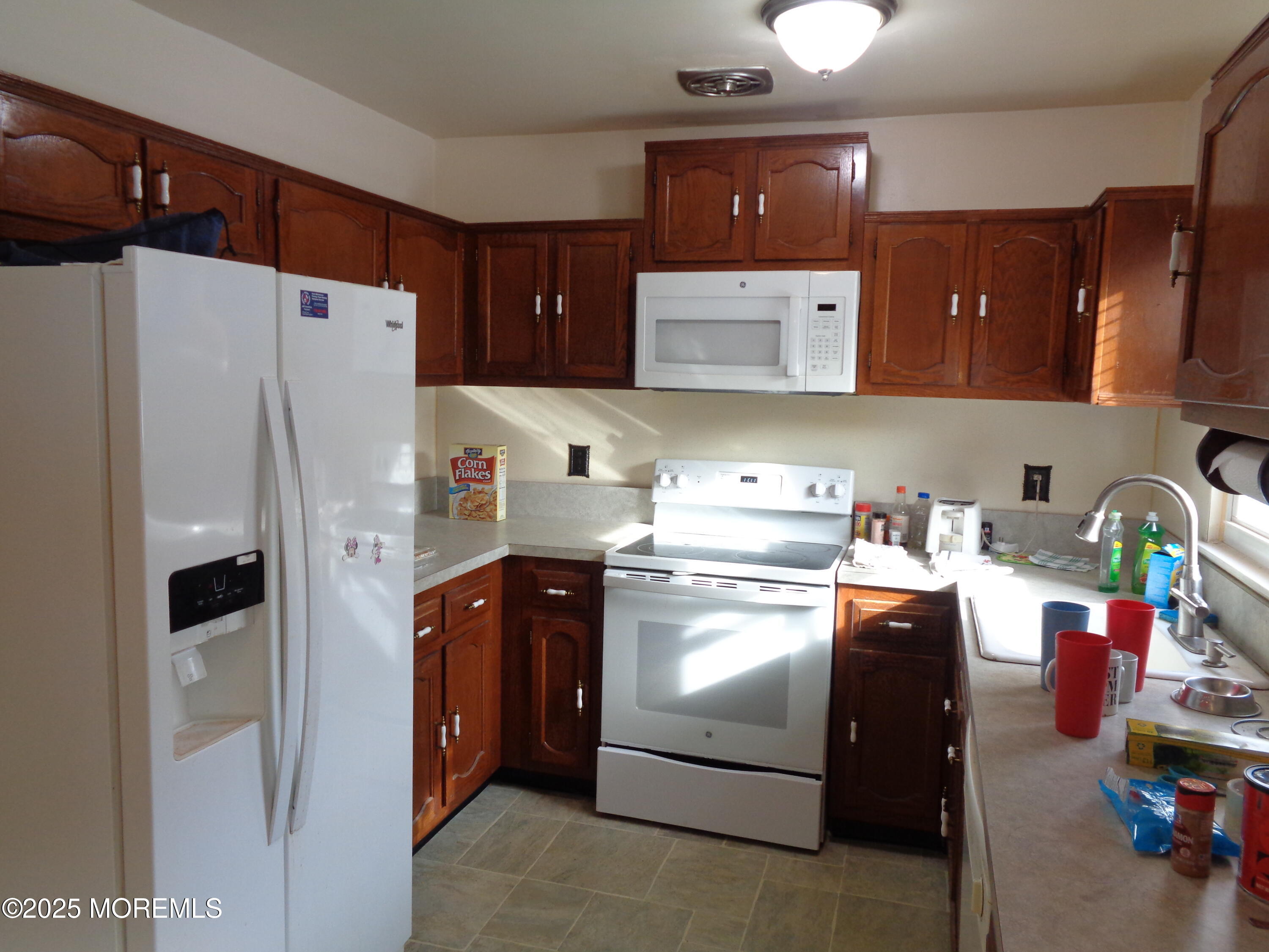 22 A Homestead Drive Whiting, NJ 08759 - Photo 5 of 15 a kitchen with a refrigerator and a stove