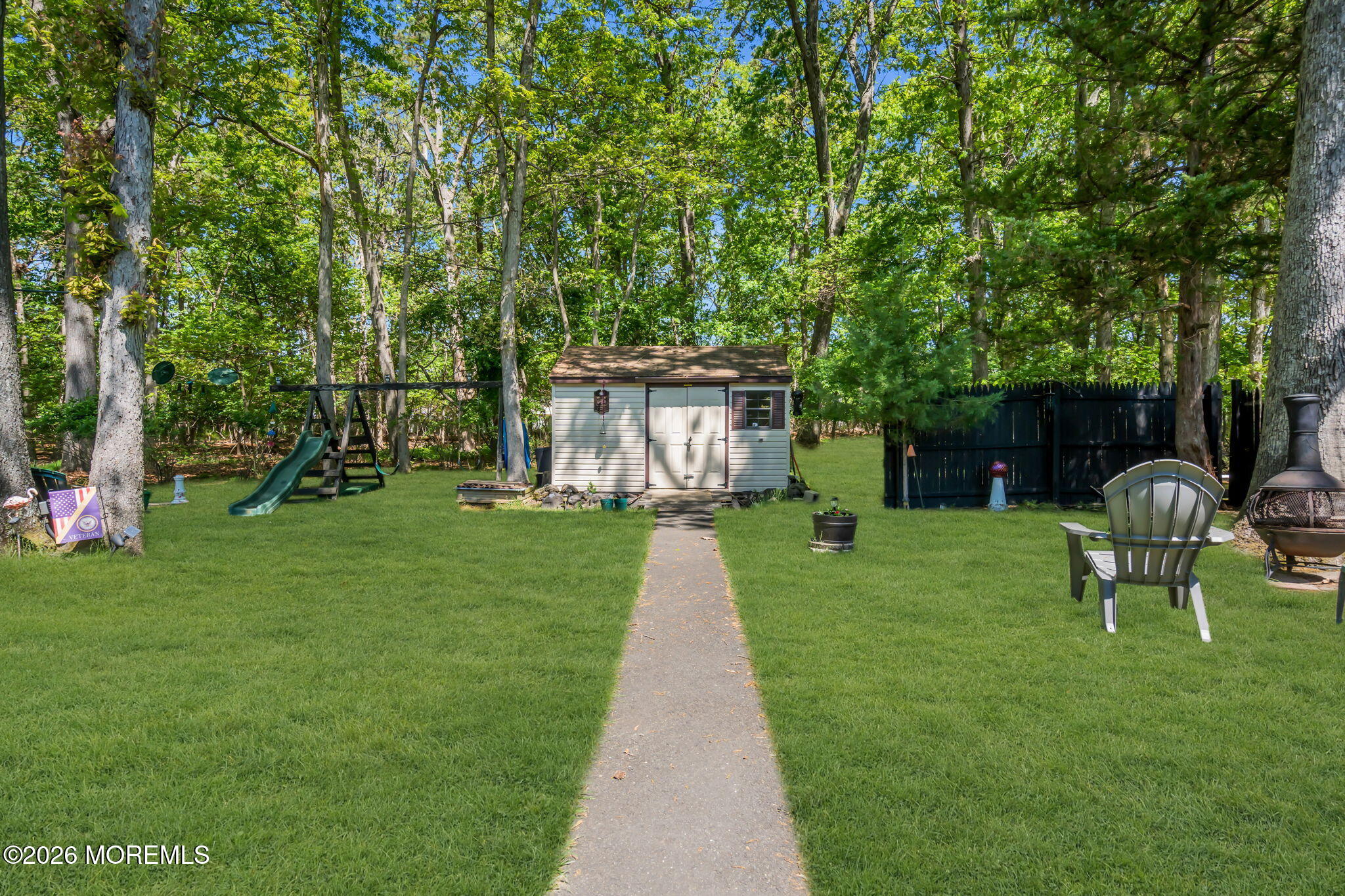 437 Shady Lane Howell, NJ 07731 - Photo 20 of 21 a front view of a house with a yard table and chairs