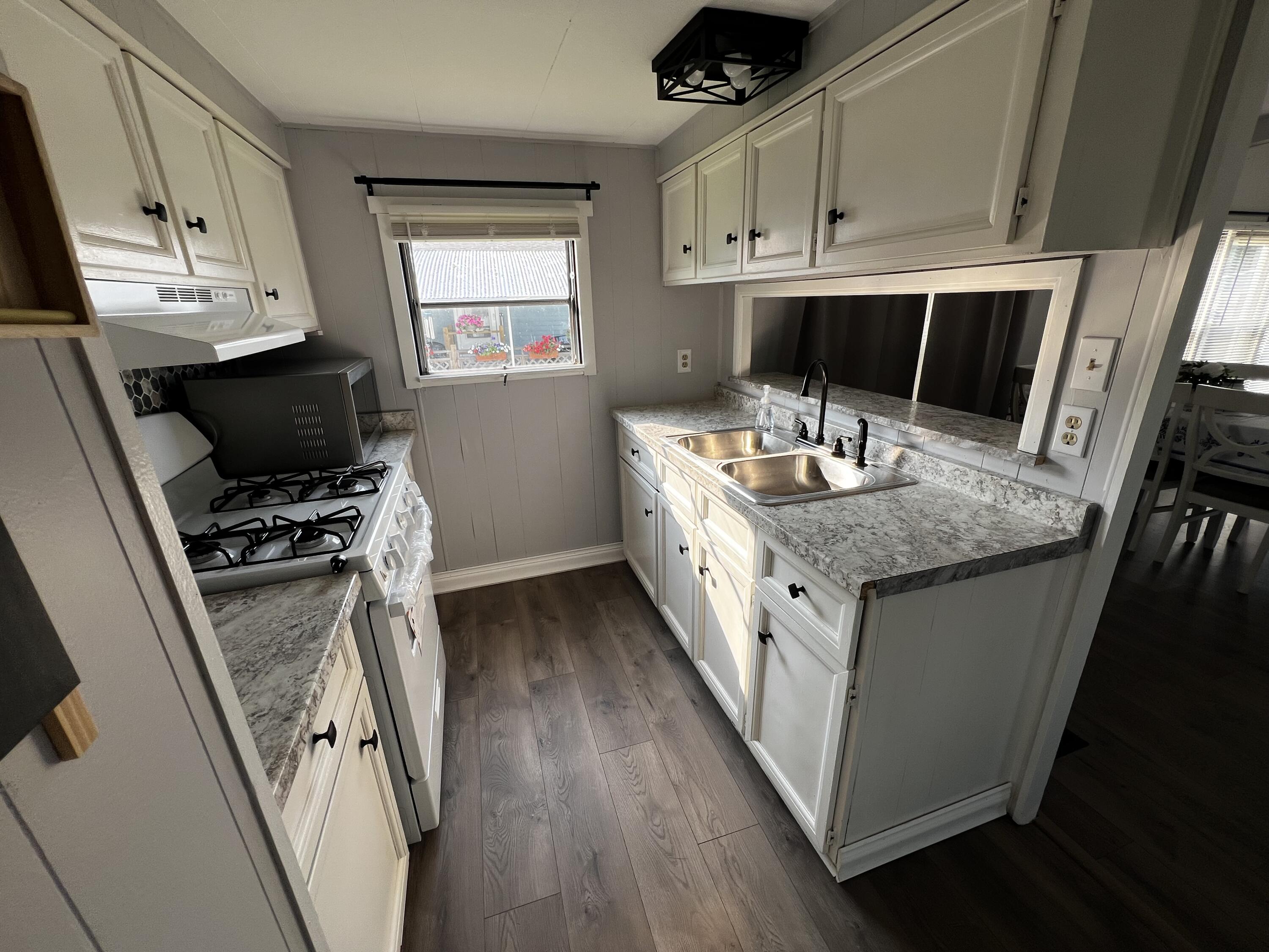 14 Joseph Street Wareham, MA 02538 - Photo 7 of 11 a kitchen with stainless steel appliances granite countertop a stove a sink and a refrigerator