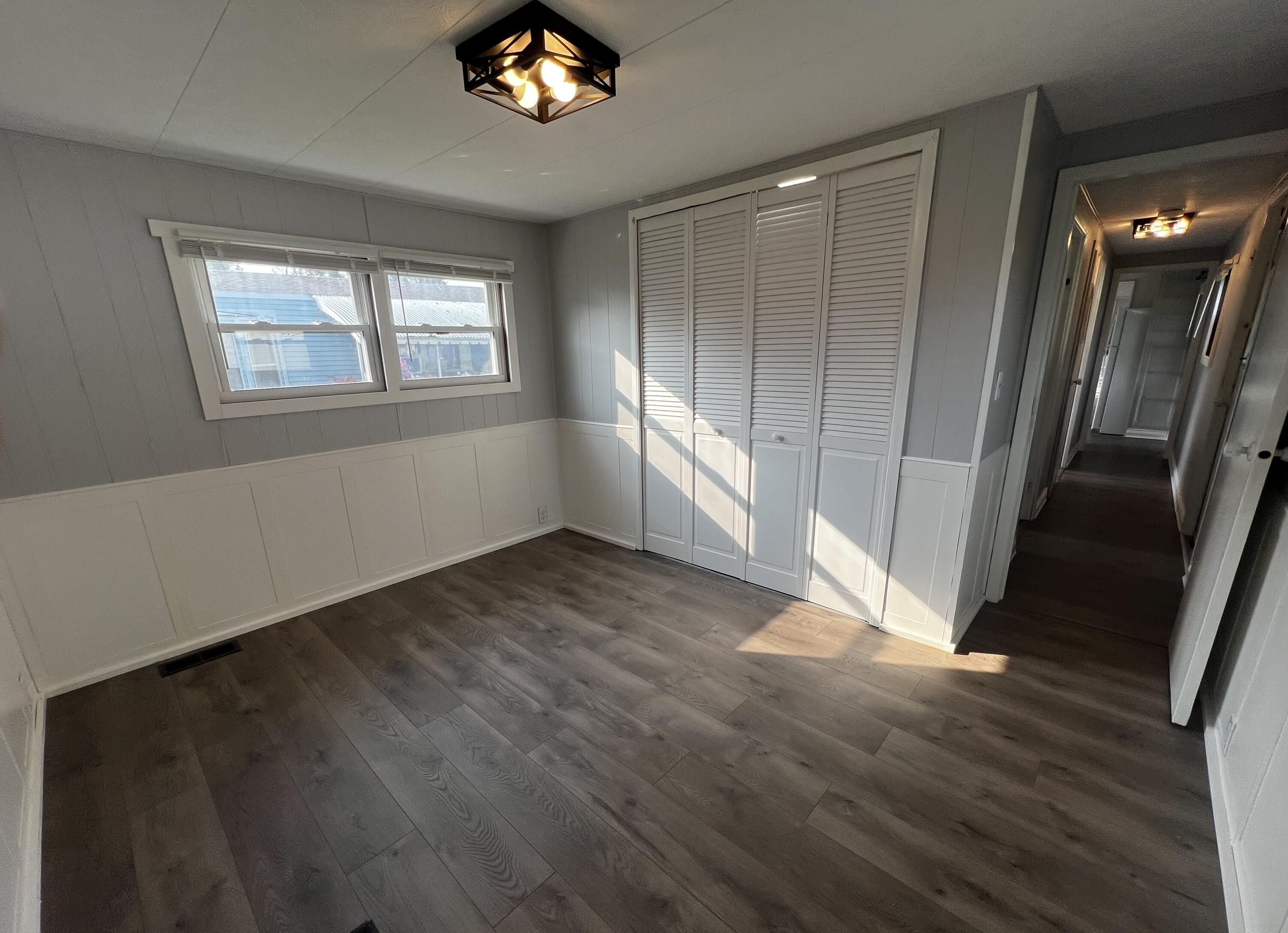 14 Joseph Street Wareham, MA 02538 - Photo 9 of 11 a view of an empty room with wooden floor and a window